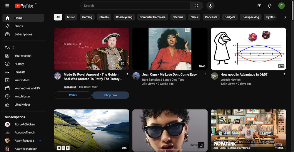 A screenshot of a YouTube homepage with a grid of recommended videos.